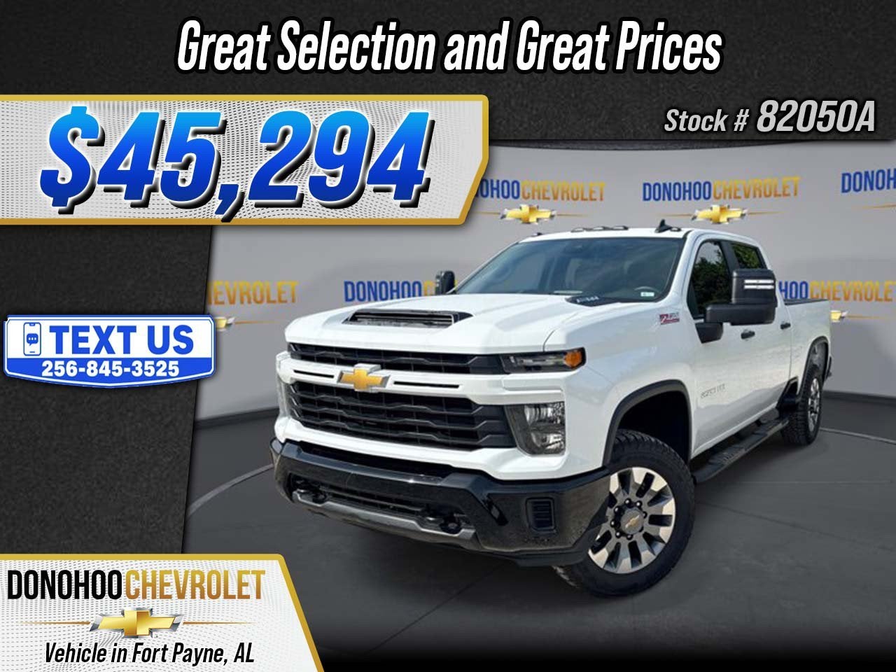2024 Chevrolet Silverado 2500 HD Custom in Summit White — front three-quarter view