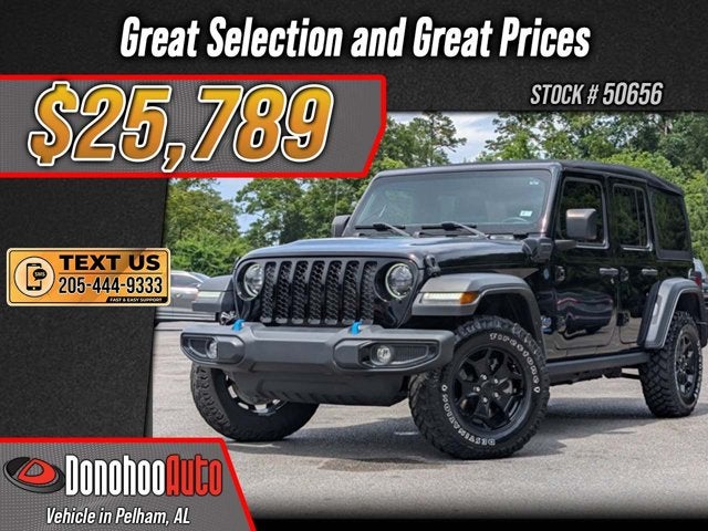 2023 Jeep Wrangler 4xe 4x4 in Black Clearcoat — front three-quarter view