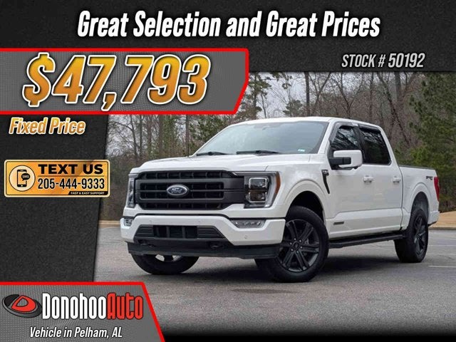 2023 Ford F-150 LARIAT in Oxford White — front three-quarter view
