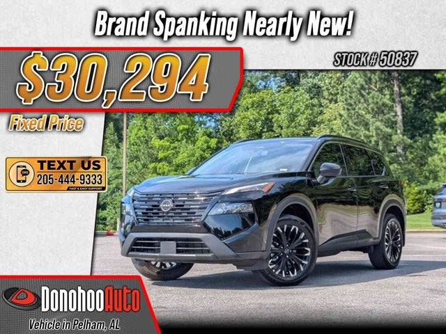 2026 Nissan Rogue Dark Armor in Super Black — front three-quarter view