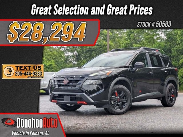 2025 Nissan Rogue Rock Creek in Super Black — front three-quarter view
